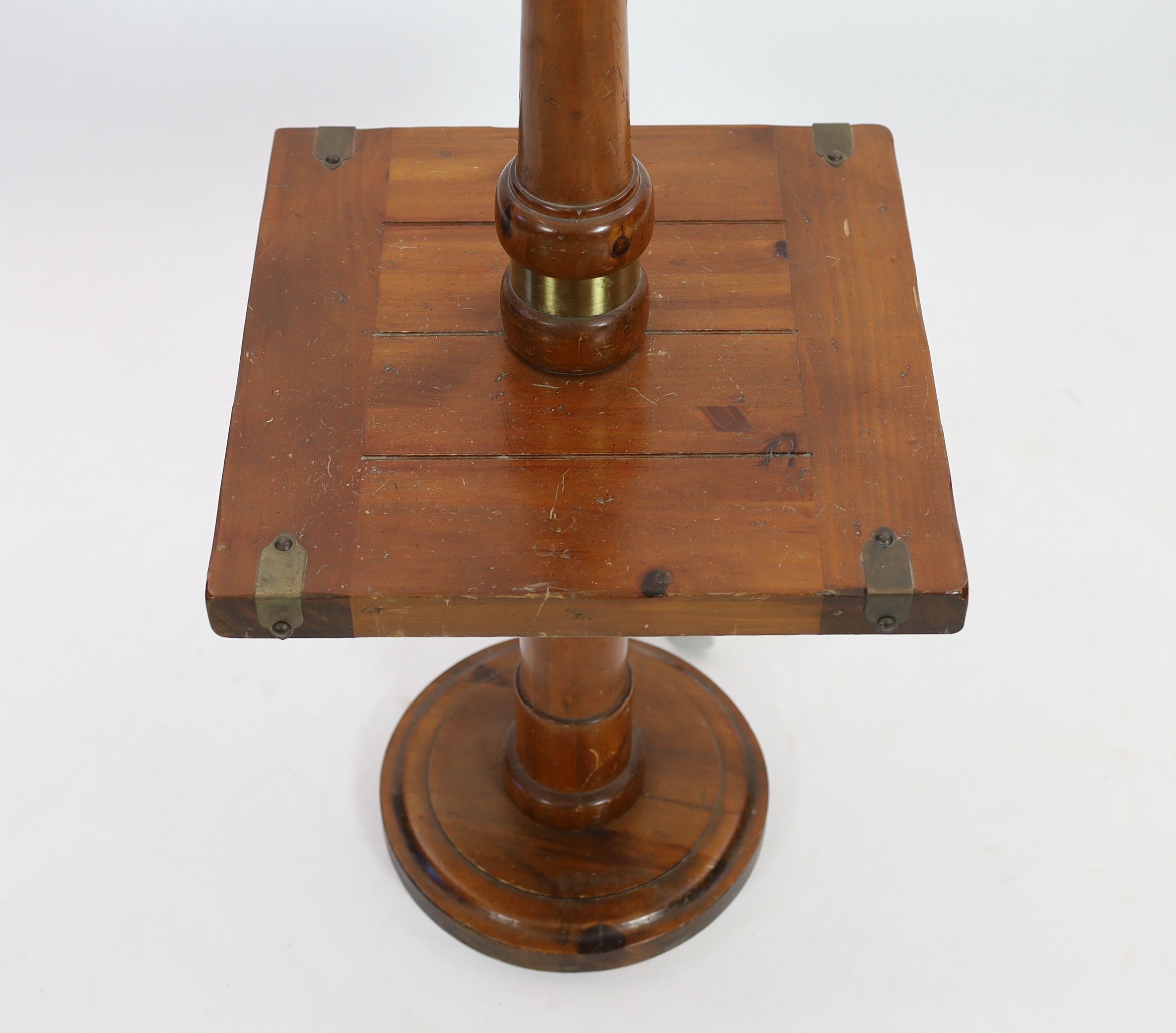 A pine and walnut standard lamp, with square mid tier, height 118cm